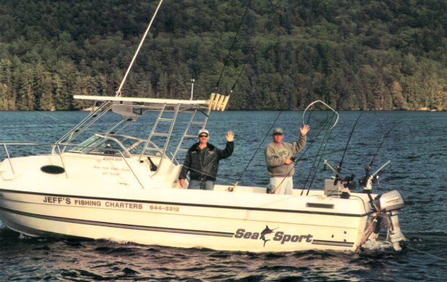 Two men on a fishing boat in Lake George.