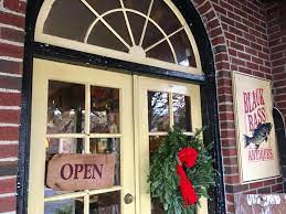 The Front door with an open sign at Black Bass Antiques.