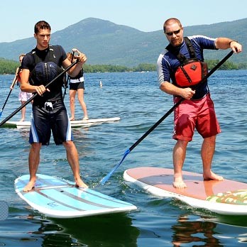 Two men on paddle-boards in Lake George.