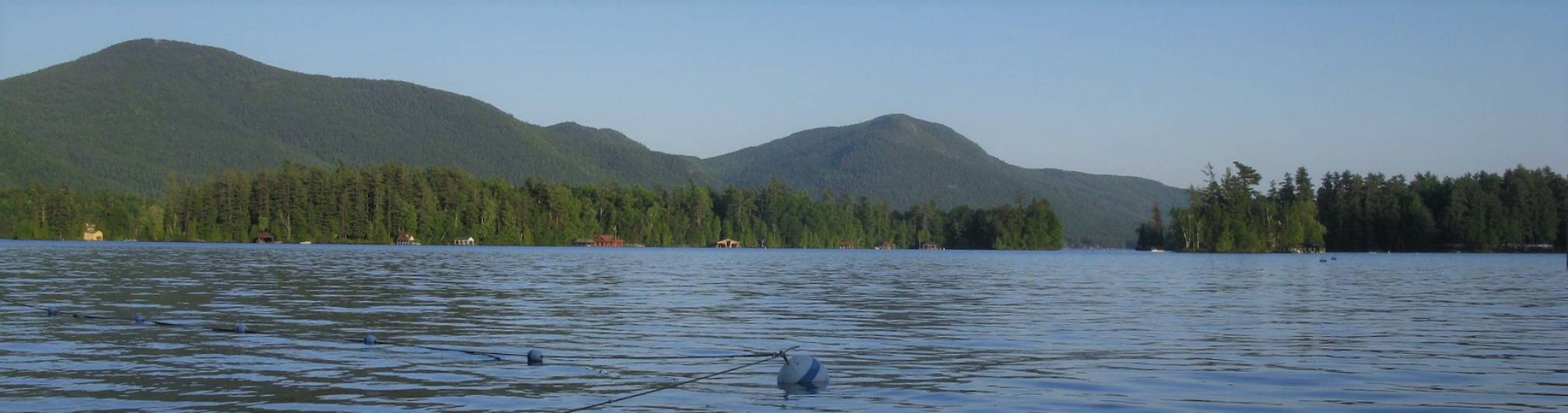 Looking out over the mountains and swim area at the point, lake george.